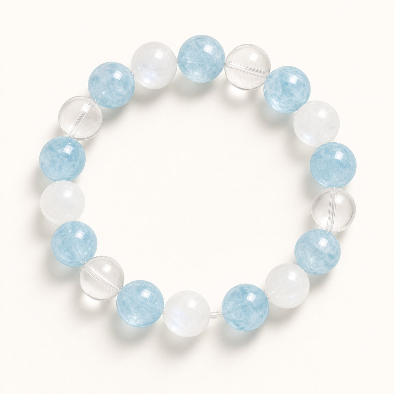Aquamarine, clear crystal and milky white bracelet composition