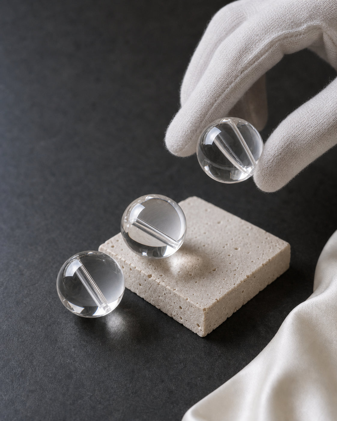 High-transparency clear quartz beads studied in natural light