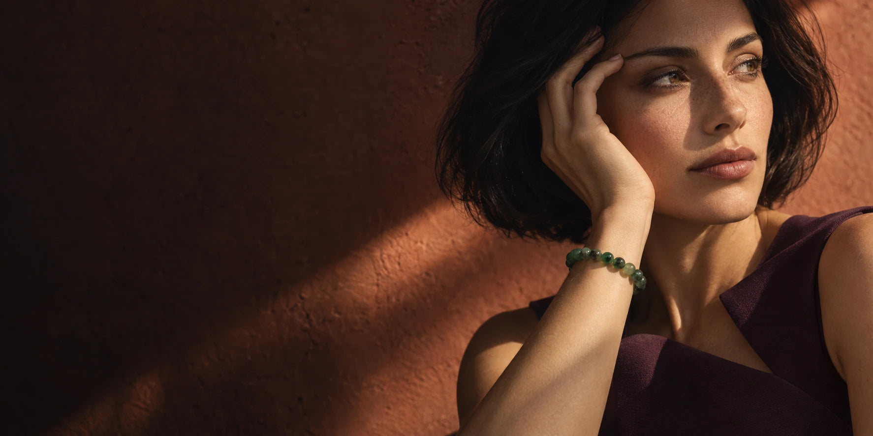 Woman wearing a green crystal bead bracelet